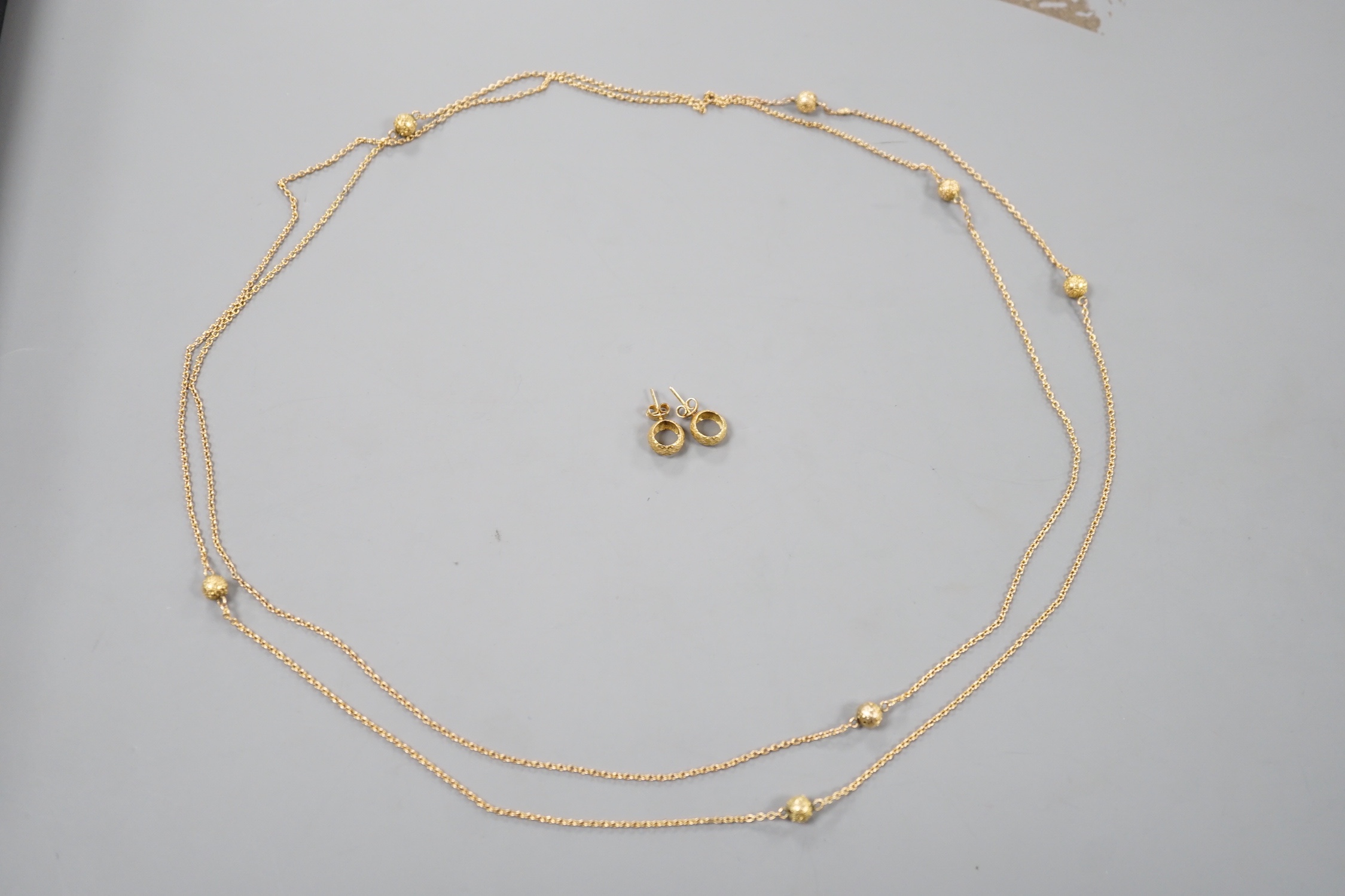 A 9ct guard chain with spherical spacers and a pair of 9k earrings, 11.7 grams.